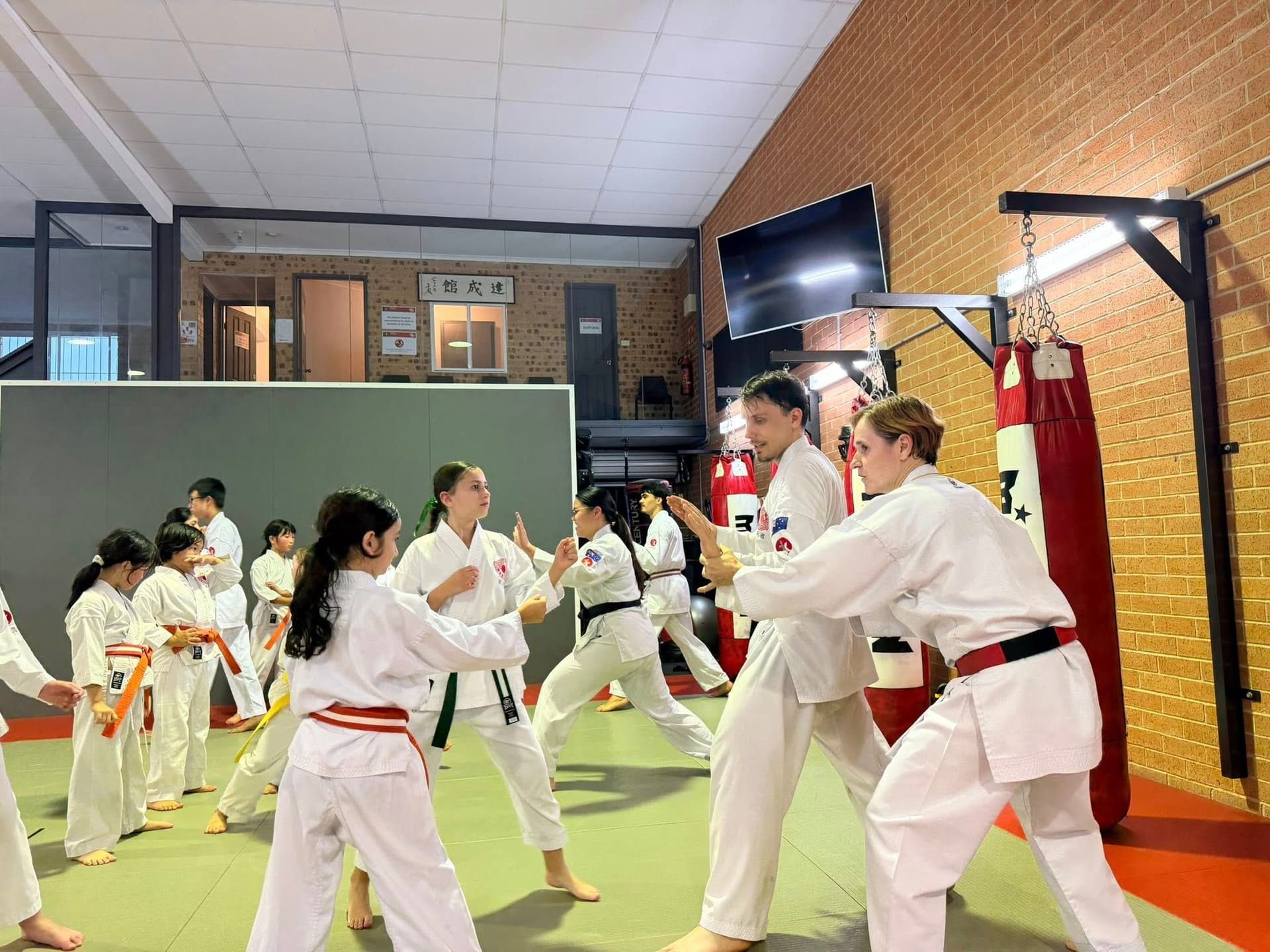 Children practicing karate in a traditional dojo during a kids karate class