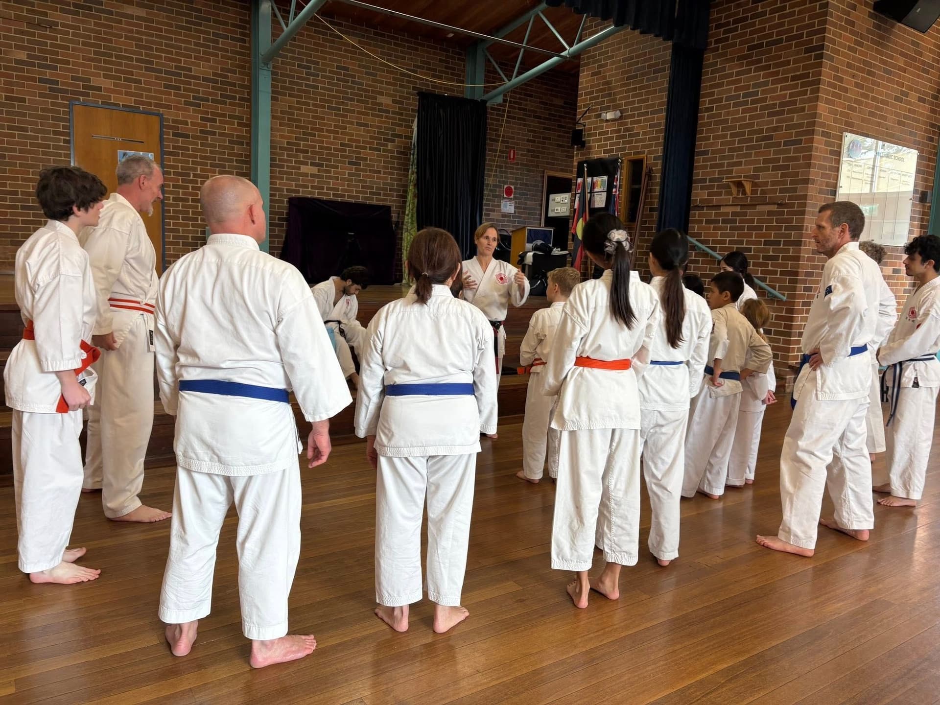 Karate students training together in a dojo class building discipline and community